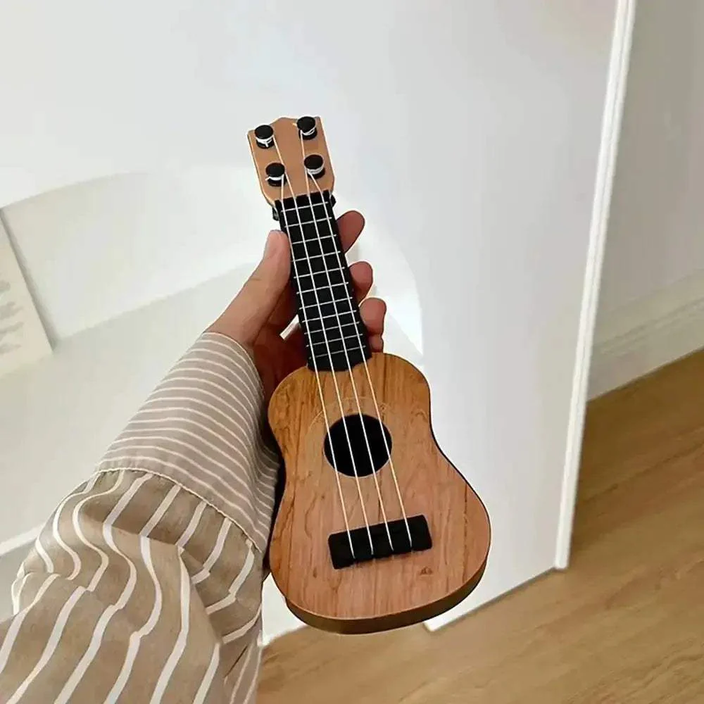 Kids Mini Four String Ukulele Guitar Beginner Friendly Educational Toy - Image 2